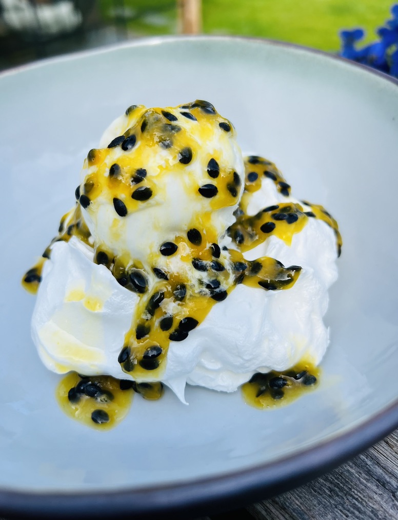 Meringue with coconut ice cream, passion fruit sereh coulis and kaffir lime