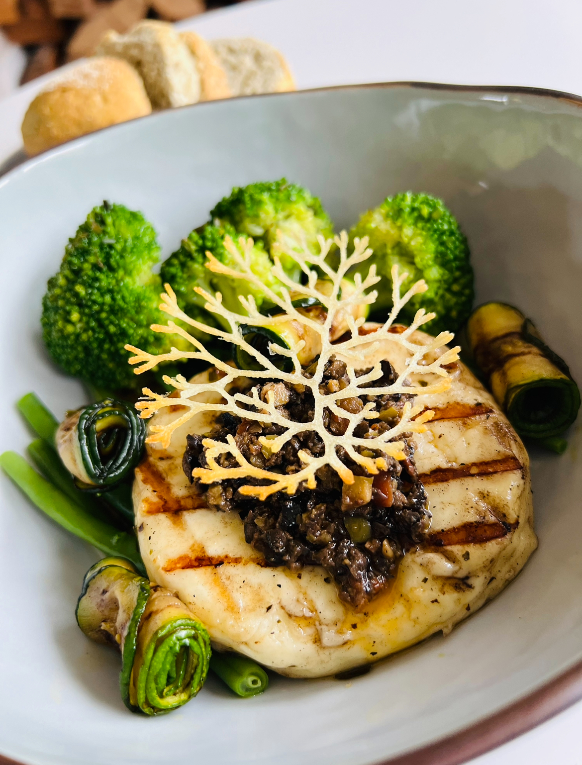 Grilled haloumi steak with greens, beurre noisette & tapenade